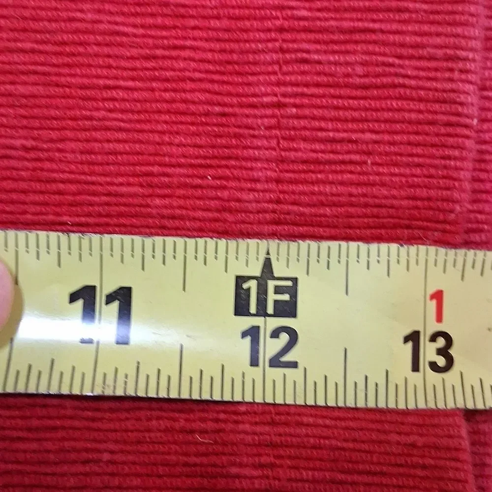 Set of 7‎ red corduroy placemats.